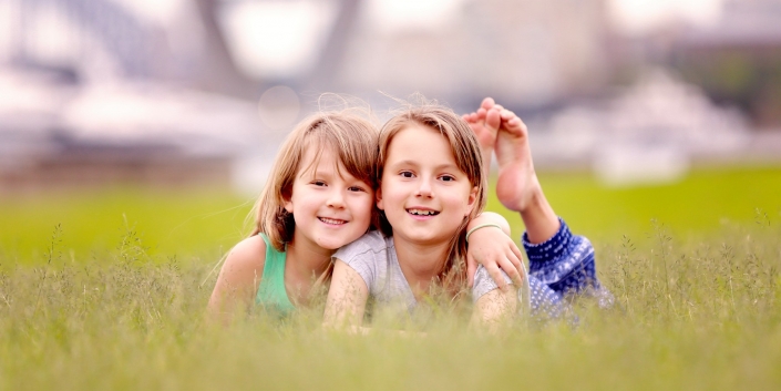 sisters photograph in tall grass